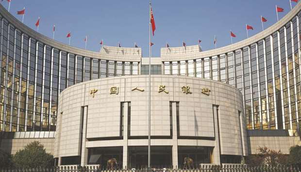 The Peopleu2019s Bank of China headquarters in Beijing. Banks in China extended $178.23bn in net new yuan loans in March, rebounding from the previous month but just below expectations, data from the PBoC showed yesterday.