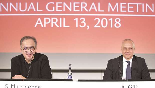 Sergio Marchionne, CEO of Fiat Chrysler Automobiles (left) speaks as he sits beside Alessandro Gili, CFO of Ferrari, during the Fiat Chrysler Automobiles annual general meeting in Amsterdam yesterday. Marchionne started his final year as CEO after Fiat Chrysleru2019s annual shareholders meeting yesterday.