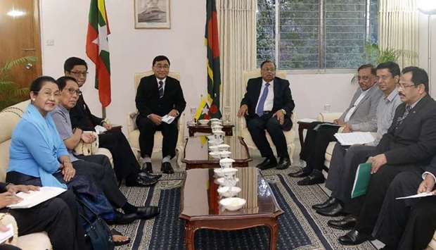 Bangladesh Foreign Minister Abul Hasan Mahmud Ali (centre R) sits next to Myanmar Social Welfare Minister Win Myat Aye (center L) during their meeting in Dhaka.
