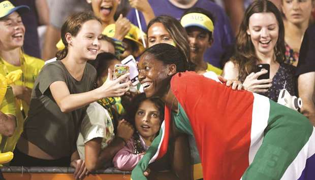 South Africau2019s Caster Semenya (right) takes photographs with fans after winning the womenu2019s 800m final during the Commonwealth Games in Gold Coast, Australia, yesterday. (AFP)