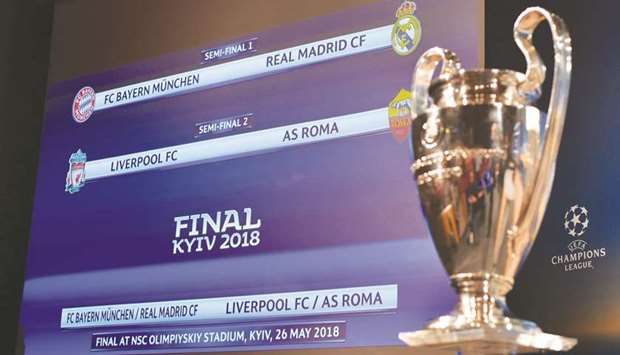 UEFA Champions League semi-finals draw is displayed on a screen alongside the trophy in Nyon, Switzerland, yesterday. (AFP)