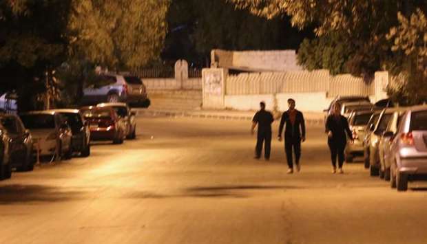 Pedestrians walking in an empty street before the daybreak Muslim prayer in Damascus' Mazze neighbourhood after the US, France, and Britain launched a joint operation against the Syrian government.
