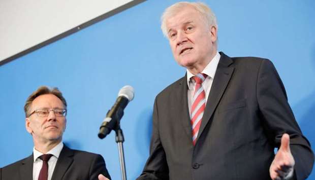 German Interior Minister Horst Seehofer (R) addresses media next to the president of the German Federal Criminal Police Office (BKA) Holger Muench as he visits the counter-terrorism center (GTAZ) in Berlin