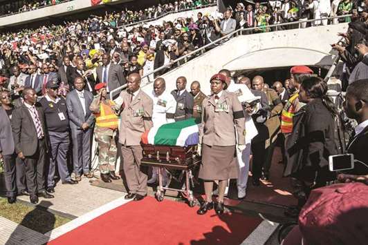 South African military personnel bring in the coffin of Winnie Madikizela-Mandela to Orlando Stadium for the funeral ceremony in Soweto yesterday.