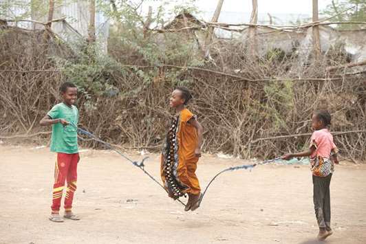 Children jump rope as they play at the Kakuma refugee camp in northern Kenya.