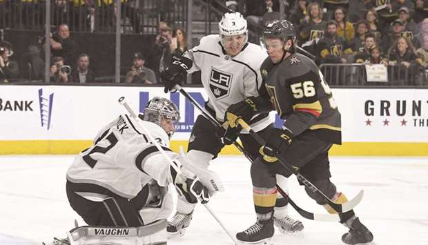 Jonathan Quick (left) of the Los Angeles Kings blocks a Vegas Golden Knightsu2019 shot as Dion Phaneuf of the Kings and Erik Haula (right) of the Knights look for a rebound.  (AFP)