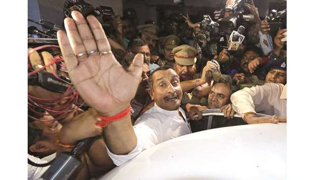 BJP legislator Kuldeep Singh Sengar reacts as he leaves a court after he was arrested on Friday in connection with the rape of a teenager, in Lucknow, yesterday.