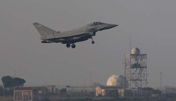 A fighter jet prepares to land at RAF Akrotiri, a military base Britain maintains on Cyprus