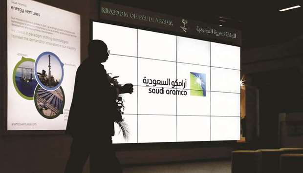 An Aramco logo sits on an electronic display at the companyu2019s corporate pavilion during the 22nd World Petroleum Congress in Istanbul on July 12, 2017. Aramco accounts illustrate the scale of the challenge Crown Prince Mohammed bin Salman faces to achieve his twin desires - a $2tn valuation in an initial public offering of the state-owned behemoth, plus a generous flow of cash into government coffers to fund a crowded policy agenda.