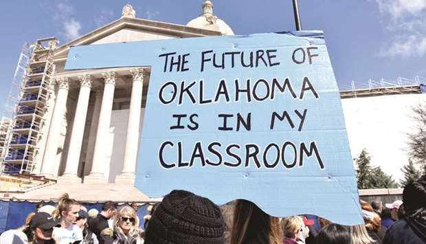 Teachers rally outside the state capitol during a teacher walkout to demand higher pay and more funding for education in Oklahoma City earlier this month.