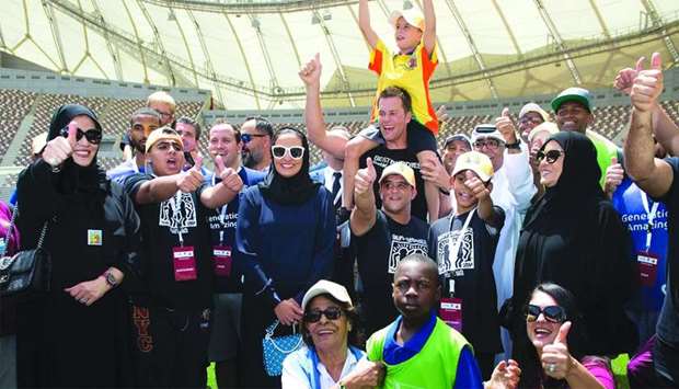 HE Sheikha Al Mayassa bint Hamad al-Thani and Tom Brady, along with officials of QM, SC and Best Buddies, join people with disabilities at the event, held at the Khalifa International Stadium in Doha on Sunday.