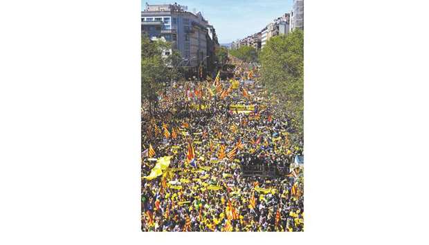 Thousands march during a demonstration in Barcelona yesterday in support of imprisoned Catalan pro-independence leaders and politicians, who were detained on charges including the misuse of public funds, sedition and rebellion, which which carries a prison sentence of 30 years.
