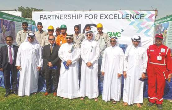 GWC officials among others with al-Kuwari at the awards ceremony at Qafacu2019s facility at the Mesaieed Industrial City.