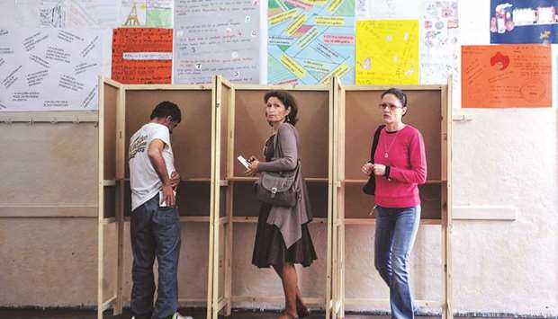 Montenegrins preparing to cast their votes at a polling station in Podgorica.
