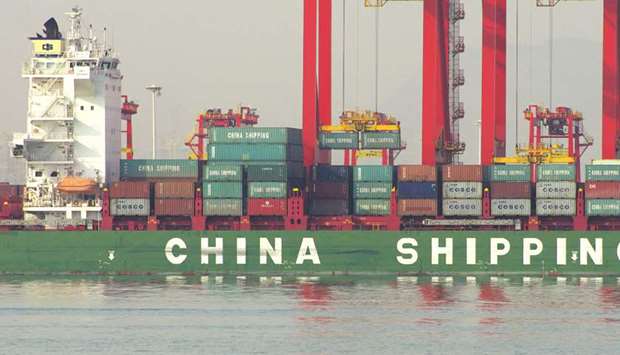 Containers being unloaded from a cargo ship at a port in Rizhao, east Chinau2019s Shandong province (file). Chinau2019s economic growth maintained a 6.8% pace, well ahead of a target for about 6.5% expansion this year, according to the median estimate of  economists in a Bloomberg News survey.