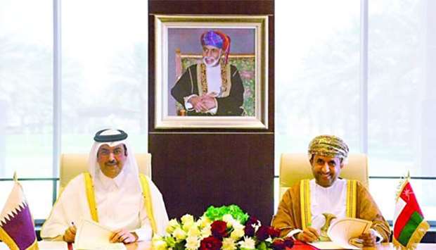 Qatar and Oman signing the protocol on Monday.