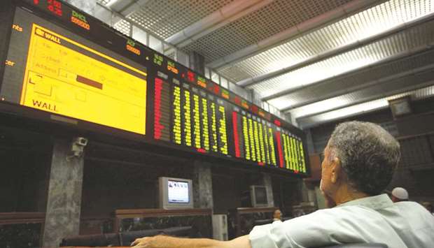 A trader is monitoring the index at Karachi Stock Exchange in Pakistan (file). Maintaining a steady path and supported by an overall performance by key sectors, Pakistanu2019s economy has accomplished a decent growth rate of 5.79%, highest in 13 years since 2004-05 when it grew by 7.52%.