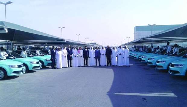 Senior Mowasalat officials, including CEO and managing director Khalid Nasser al-Hail at the launch of Jetta taxis.