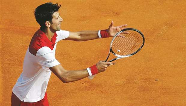 Serbiau2019s Novak Djokovic celebrates winning his Monte Carlo Masters first round match against Serbiau2019s Dusan Lajovic yesterday. (Reuters)