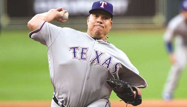 Texas Rangers starting pitcher Bartolo Colon delivers to the Houston Astros during the MLB game in Houston, Texas, on Sunday. (USA TODAY Sports)