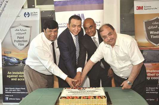 Officials cutting a cake to mark the occasion.