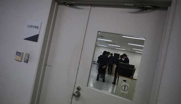 Guards at the East Japan Immigration Center stand inside a processing room at the center in Ushiku, Ibaraki prefecture, Japan. March 19, 2015 file picture.