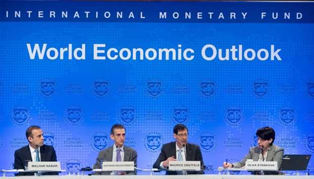 Maurice Obstfeld (2nd R), Economic Counsellor and Director of the Research Department at the IMF; Gian Maria Milesi-Ferretti (2nd ), Deputy Director of the Research Department at the IMF; Malhar Nabar (L), Deputy Division Chief of the Research Department at the IMF; and Olga Stankova (R), Special Assistant to the Director of the IMF Communications Department