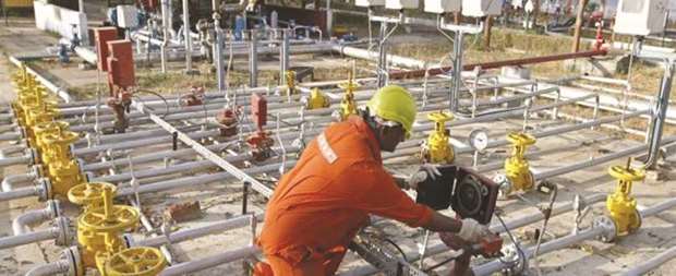 An employee works at Indiau2019s Oil and Natural Gas Corpu2019s oil field in Ahmedabad. ONGC had filed a claim for $98.94mn against the government of Sudan in a London court, an official said yesterday.