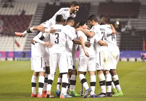 In this February 8, 2018, picture, Al Sadd players celebrate Jugurtha Hamrounu2019s goal in the QNB Stars League match against Al Rayyan. Al Sadd had won the match, the last meeting between the two clubs, 2-0.