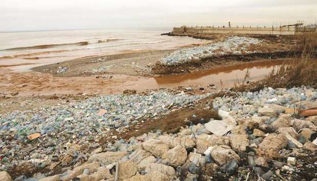 Plastic bottles litter the Ghadir River bed as it pours into the Mediterranean Sea near Beirutu2019s International Airport. Researchers in the US and Britain have accidentally engineered an enzyme which eats plastic and may eventually help solve the growing problem of plastic pollution, a study said yesterday.