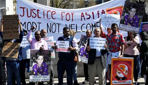 Demonstrators stage a protest against the visit by India's Prime Minister Narendra Modi opposite Downing Street in London