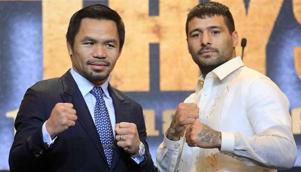 Philippine senator and boxing icon Manny ,Pacman, Pacquiao (L) poses with welterweight world title holder Lucas Matthysse
