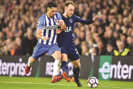 Brightonu2019s Beram Kayal (let) and Tottenham Hotspuru2019s Christian Eriksen vie for the ball during the English Premier League match in Brighton, southern England. (AFP)