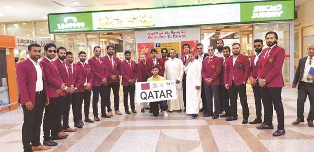 Qatar cricket squad pose after they land in Kuwait for the Asian sub-regional qualifiers for the 2020 ICC Twenty20 World Cup.