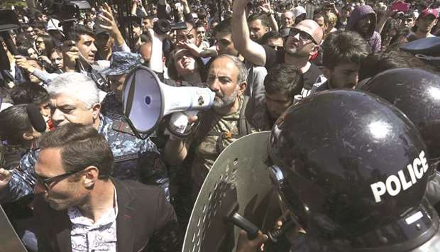 Armenian opposition MP Nikol Pashinyan uses a megaphone as he delivers a speech during a protest in Yerevan after parliament voted to allow former president Serzh Sarksyan to become prime minister.