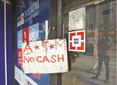 An ATM facility with a u2018no cashu2019 sign is seen in Bengaluru yesterday. The RBI has said that there was sufficient cash in its vaults and currency chests and it was taking steps to move currency to areas which have witnessed unusually large cash withdrawals.