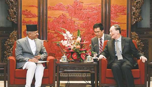 Nepalu2019s Foreign Minister Pradeep Kumar Gyawali, left, talks to Chinau2019s Vice President Wang Qishan during a meeting at the Zhongnanhai Leadership Compound in Beijing yesterday.