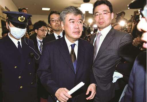Japanu2019s Vice Finance Minister Junichi Fukuda leaves the ministry after announcing his resignation in Tokyo.