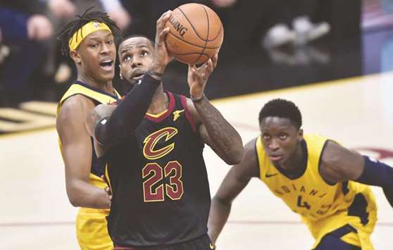 Cleveland Cavaliers forward LeBron James drives to the basket against Indiana Pacers centre Myles Turner (left) and guard Victor Oladipo (right) during the first half in game two of the first round of the 2018 NBA Playoffs at Quicken Loans Arena in Cleveland. PICTURE: USA TODAY Sports