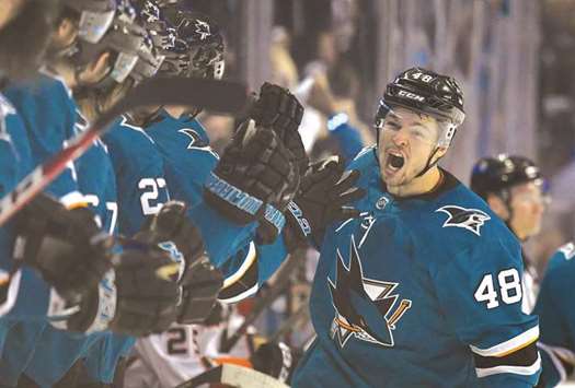 Tomas Hertl of San Jose Sharks is congratulated by teammates after scoring a goal against the Anaheim Ducks during the third period in game four of the Western Conference first round in the NHL Stanley Cup Playoffs at SAP Centre in San Jose, California. (AFP)
