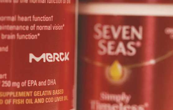 The Merck KGaA logo is seen on a tub of Seven Seas Cod Liver Oil in this photograph in London. Mercku2019s Seven Seas cod liver oil and Bion3 supplements had reportedly attracted interest from rival Reckitt Benckiser Group as well as drug makers Mylan and Perrigo Co.