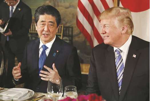 US President Donald Trump (right) looks on as Japanu2019s Prime Minister Shinzo Abe speaks while dining at Trumpu2019s Mar-a-Lago estate in Palm Beach, Florida. u201cPresident Trump and I agreed to start talks for free, fair and reciprocal trade deals,u201d Abe said at a joint news conference with Trump.
