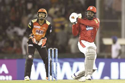 Kings XI Punjabu2019s Chris Gayle plays a shot against Sunrisers Hyderabad during the IPL match at the Punjab Cricket Association Stadium in Mohali yesterday. (AFP)