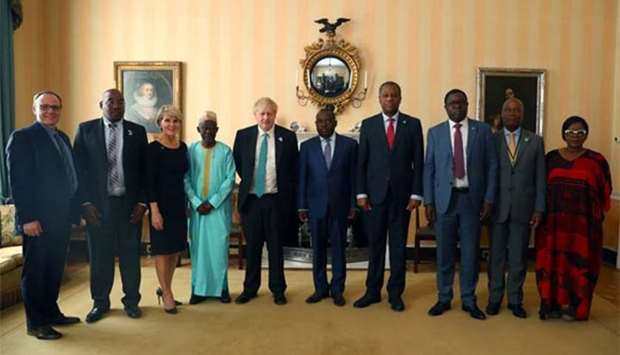 Britain's Foreign Secretary Boris Johnson poses for a photograph before a meeting with the Zimbabwe and other African delegations at the CHOGM conference in London on Friday.