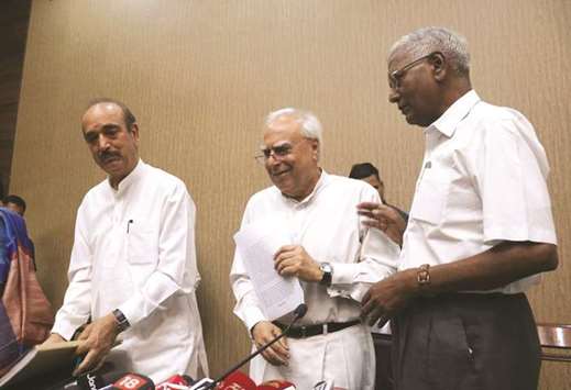 Congress leaders Ghulam Nabi Azad, Kapil Sibal and CPI leader D Raja attend a press conference to give details on the impeachment motion against the chief justice of India, in New Delhi yesterday.