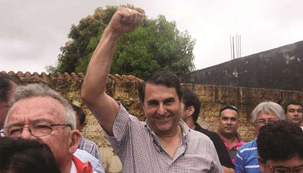 Former Paraguayan president Federico Franco joins a demonstration outside the historic Victory Barracks in San Lorenzo, near Paraguay, against the occupation of the barracks by alleged landless people who are demanding the government give them part of the 76-hectare lot.