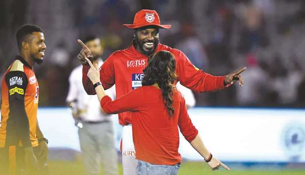 Kings XI Punjab cricketer Chris Gayle dances with teamu2019s owner Preity Zinta after winning the 2018 Indian Premier League match against Sunrisers Hyderabad in Mohali on Thursday. (AFP)