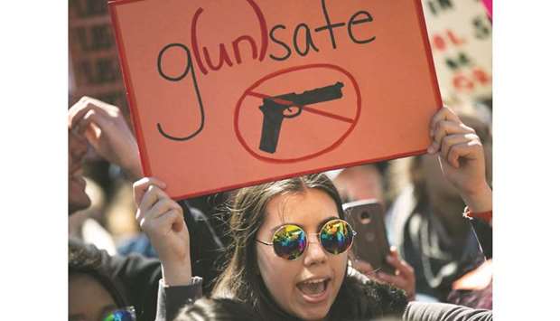 Student activists rally yesterday against gun violence at Washington Square Park, near the campus of New York University, New York City.
