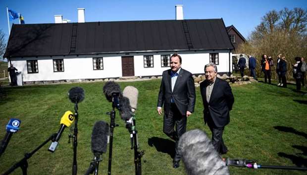 United Nations Secretary-General Antu064enio Guterres (R) and Sweden's Prime Minister Stefan Lu0650fven arrive to speak to the press during the annual informal working meeting with the UN Security Council at Dag Hammarskjold's farm at Backakra, close to Ystad, southern Sweden