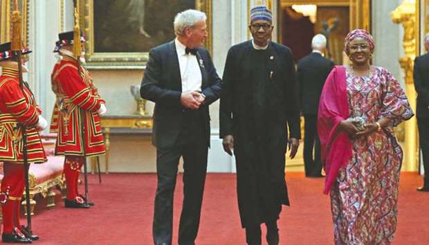 Nigeriau2019s President Muhamadu Buhari (centre) arrives to attend The Queenu2019s Dinner during The Commonwealth Heads of Government Meeting (CHOGM), at Buckingham Palace in London on Thursday.